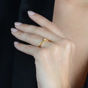 Gold Solitaire Ring with Zirconia Point of Light